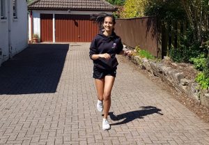 Fundraiser Shraddha running outside her house