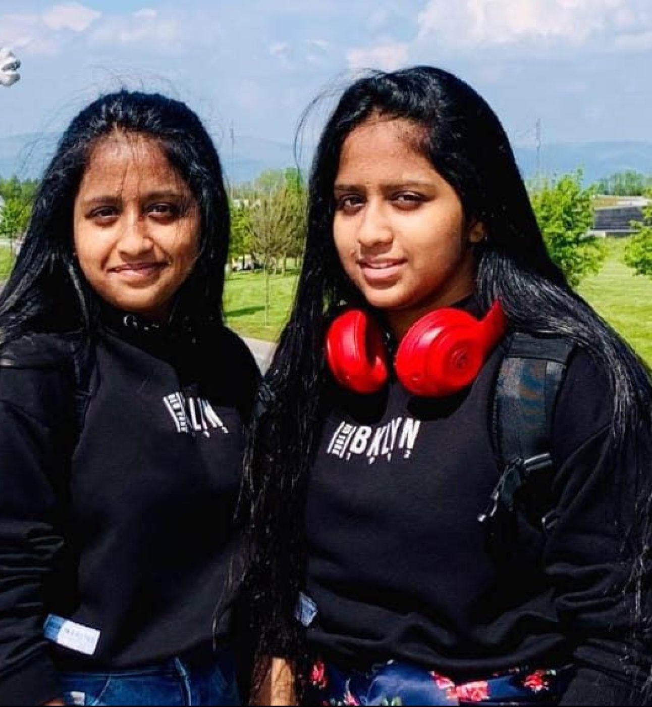 Hasini and Hanshika stood outside together, smiling