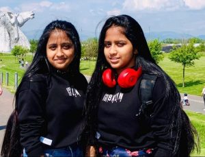 Hasini and Hanshika stood outside together, smiling