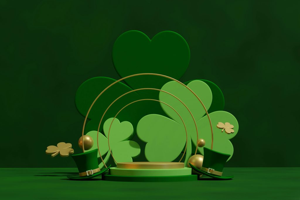 St Patricks Day image - dark green background with various four leaf clovers and gold details 