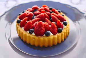 Strawberry and blueberry flan on a plate